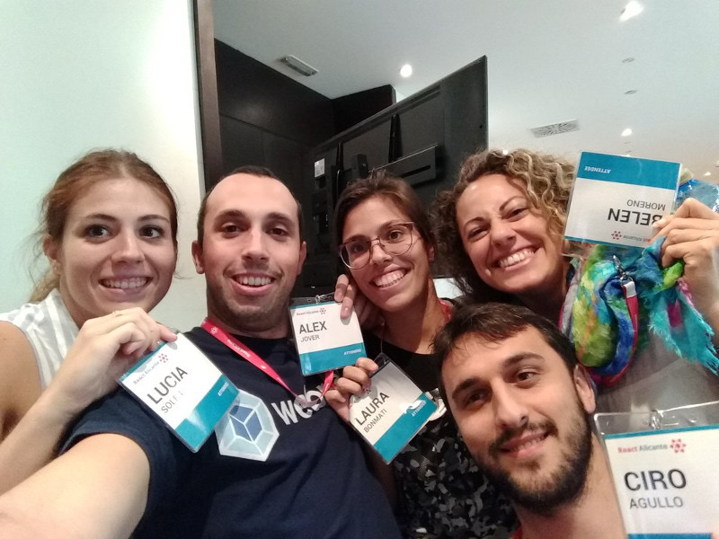 Attendees taking a selfie with their badges, 2017