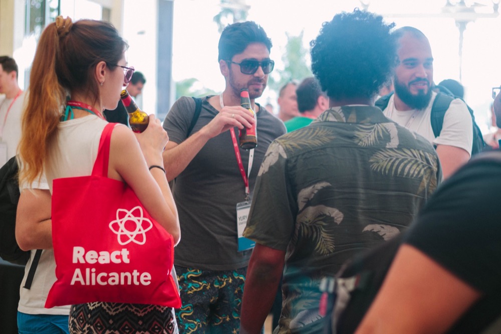 Attendees with the React Alicante tote bag, 2019