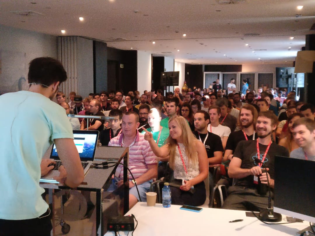 The audience smiling during a talk, 2017